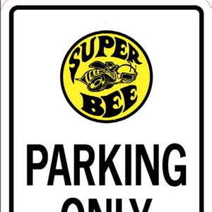 May include: A yellow and black sign with the words "Super Bee" in a circle. The sign reads "Parking Only. Violators Will Be Stung."
