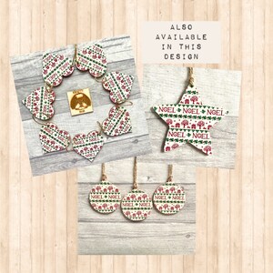 May include: A collection of wooden holiday ornaments featuring heart, star, and circular shapes with a repeating pattern of red and green trees, houses, and the text NOEL. Each piece includes a jute twine hanger. Text reads ALSO AVAILABLE IN THIS DESIGN.
