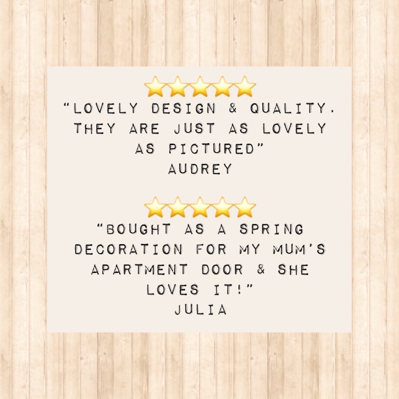 Two customer reviews with five star ratings. The first review reads 'LOVELY DESIGN & QUALITY. THEY ARE JUST AS LOVELY AS PICTURED' AUDREY. The second review reads 'BOUGHT AS A SPRING DECORATION FOR MY MUM'S APARTMENT DOOR & SHE LOVES IT!' JULIA.