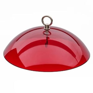 May include: Red plastic dome with a silver hook on top. The dome is designed to protect bird feeders from squirrels.