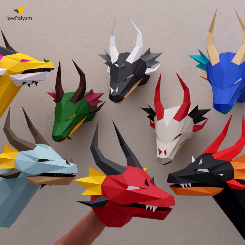 3d paper craft dragon puppets and trophies in different colors.