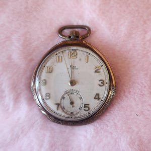 Vintage Pocket watch. Elco, 17 jewels, Incabloc. Runs but time is inaccurate.