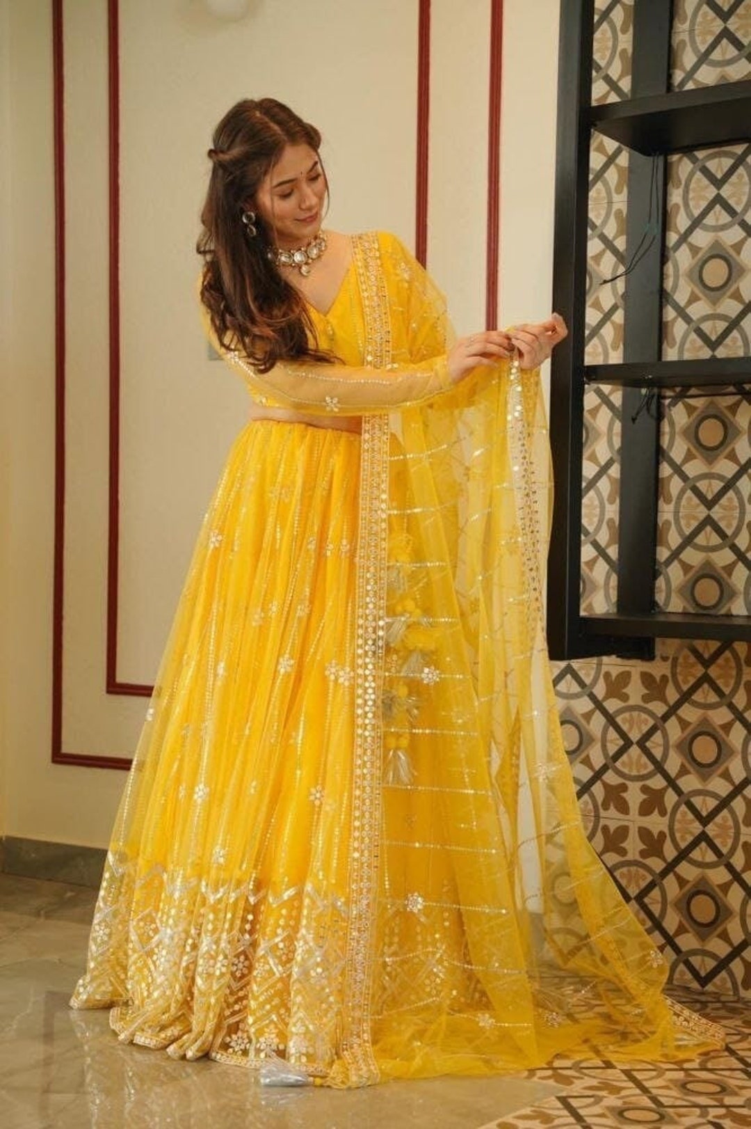 yellow net lehenga choli with dupatta