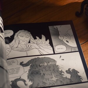 May include: Black and white comic book page with a man with long hair and a beard, a creature with horns and teeth, and the text "Owl..." and "HAT SOF".