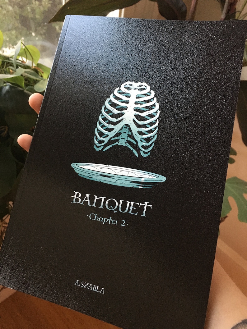 May include: A black book cover with a teal ribcage illustration and a plate underneath. The text "BANQUET" and "Chapter 2." is printed in white. The author's name, "A. SZABLA", is printed in white at the bottom.