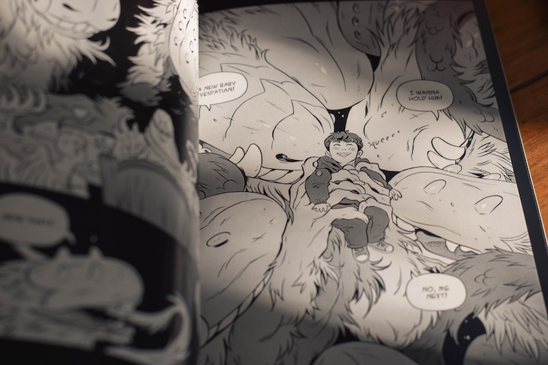 May include: A black and white comic book page with a young person surrounded by furry creatures. The creatures are saying "I wanna hold him!" and "No, me next!" The young person is smiling and saying "Squee!"