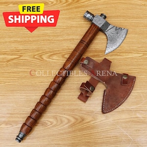 May include: A tomahawk with a wooden handle and a Damascus steel head. The tomahawk has a leather sheath.