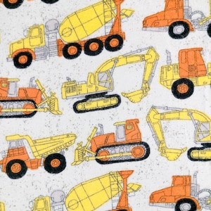 May include: A repeating pattern of construction vehicles in orange, yellow, and gray on a white background. The design includes dump trucks, cement mixers, excavators, and bulldozers. The vehicles are outlined in black.