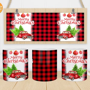 May include: Red and black buffalo check mug with a white background. The mug features a red truck with a Christmas tree in the back. The text "Merry Christmas" is written in white on the mug.