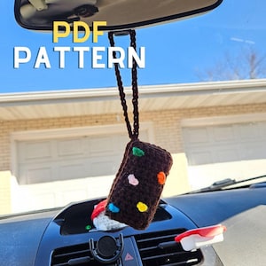 May include: A brown crocheted car air freshener with colorful dots hanging from a rearview mirror. The text "PDF PATTERN" is visible in the image.