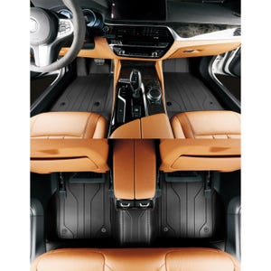 May include: Black all-weather floor mats for a car interior. The mats have a textured surface and are designed to protect the car's carpet from dirt, spills, and wear and tear.