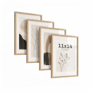 Può includere: Un set di quattro cornici rettangolari con bordi in legno chiaro e passe-partout bianchi. Le cornici contengono stampe d'arte astratta con disegni botanici a linee, forme organiche e toni neutri. Una cornice riporta il testo 11x14.