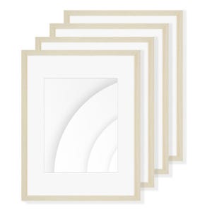 May include: Five rectangular picture frames with white mounts and light wood-effect frames are stacked diagonally. The frames are designed to display artwork, with a white interior and a light-coloured border.