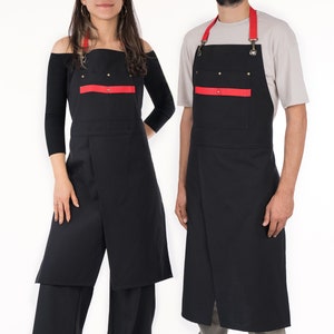 May include: Two black aprons with red accents and adjustable straps. The aprons have a large pocket on the front.