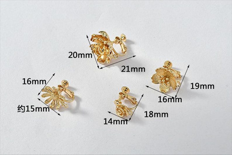 May include: Three pairs of gold-tone clip-on earrings with floral designs. The earrings are approximately 1.5 inches, 1.6 inches, and 1.9 inches in diameter.