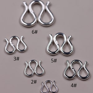 May include: Six silver jump rings of different sizes, labeled 1# through 6#. The rings are in the shape of a figure eight.