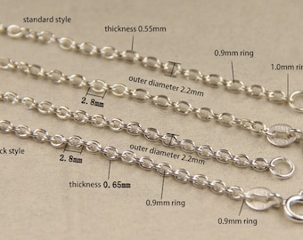 May include: Close-up of four silver chains with different thicknesses and ring sizes. The chains are labeled "standard style", "thickness 0.55mm", "outer diameter 2.2mm", "0.9mm ring", "1.0mm ring", "thick style", "thickness 0.65mm", and "0.9mm ring".