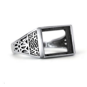 May include: A silver ring with a square-shaped bezel, ideal for adding a personalised touch. The ring features intricate filigree details on the band.