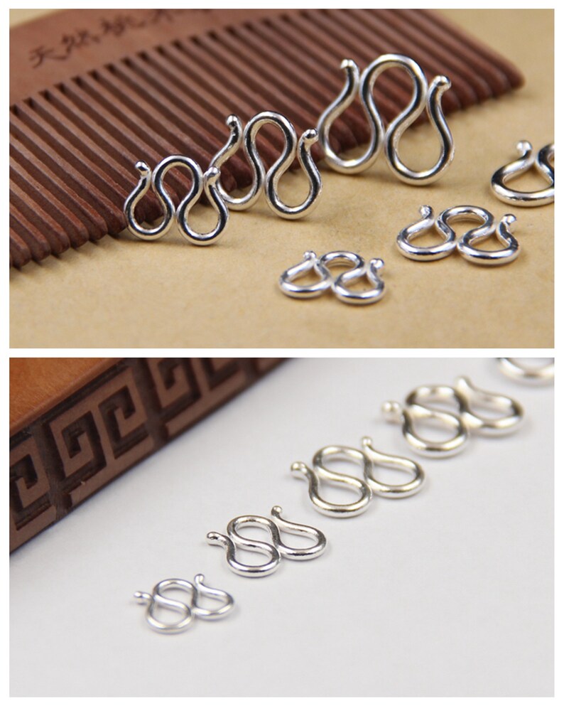 May include: A set of six silver-toned metal clasps in various sizes. The clasps are shaped like the number eight, with two loops connected together. The clasps are arranged in a row from largest to smallest.