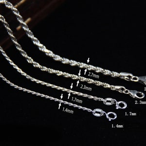 May include: Close-up of four silver rope chains of varying thicknesses. The chains range from 1.4mm to 2.7mm in diameter. Each chain has a lobster clasp. The image is on a dark background.
