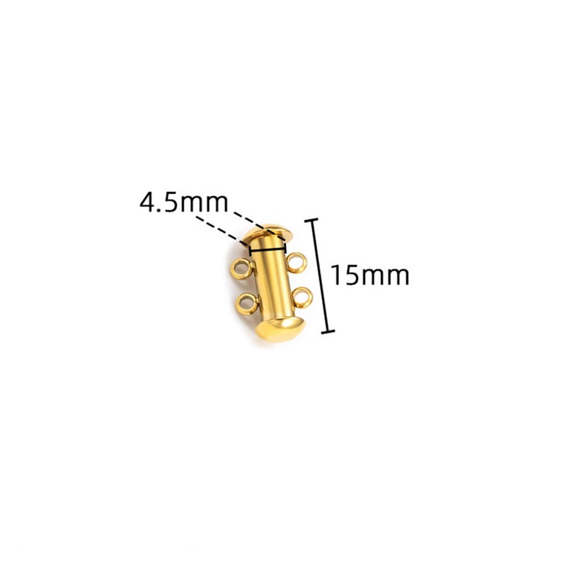 May include: A gold-colored cylindrical jewelry clasp featuring two small loops on each side for attachment. The component measures 15mm in total length and 4.5mm in width, as indicated by the black measurement lines and text labels visible in the image.