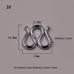 May include: Silver S-shaped connector for necklaces, measuring 12 mm in length and 10.8 mm in height. The connector is 1.3 mm thick and marked with "S999" for 99.9% silver purity. It is designed for necklace chains with a thickness of 2.5 mm to 3.5 mm.