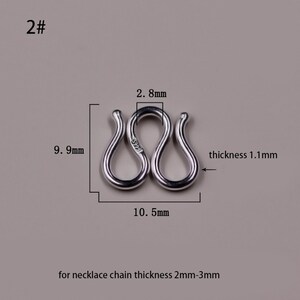 May include: Silver-toned metal connector for a necklace chain, measuring 2.8 inches in length, 0.99 inches in width, and 0.11 inches in thickness. The connector is marked with "S999" and is designed for necklace chains with a thickness of 2 to 3 millimeters.