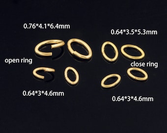 May include: Assortment of gold jump rings in various sizes. The rings are oval shaped and some are open, while others are closed. The measurements of the rings are listed in millimeters.