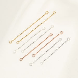 May include: A set of six extender chains for jewelry making. The chains are available in gold, silver, and rose gold finishes. Each chain has two jump rings at the ends.