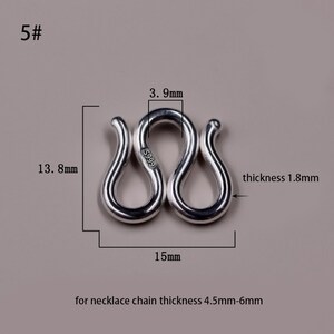 May include: Silver S-shaped clasp for necklaces, measuring 1.8 mm thick, 15 mm wide, and 13.8 mm tall. The clasp is marked with "S999" and is designed for necklace chains between 4.5 mm and 6 mm thick.