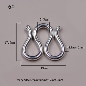 May include: Silver S-shaped clasp for necklaces, measuring 19 mm wide, 17.5 mm tall, and 5.3 mm thick. The clasp is marked "S999" and is designed for necklace chains with a thickness of 7 mm to 9 mm.