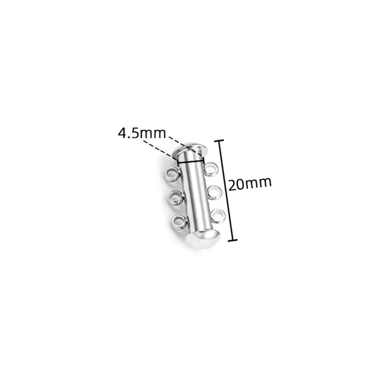 May include: A silver-toned metal jewelry clasp featuring a cylindrical tube design with three small circular loops on each side. The component is labeled with dimensions of 4.5mm for the width and 20mm for the total length of the piece.