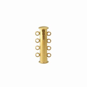May include: A gold-toned cylindrical jewelry clasp featuring four small circular loops on each side, totaling eight connection points. The clasp has a smooth, polished finish with a flat cap at the top and a slightly wider base at the bottom.