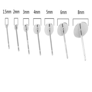 May include: A set of eight silver earring posts in different sizes, ranging from 1.5mm to 8mm. The posts are all made of metal and have a smooth, polished finish.