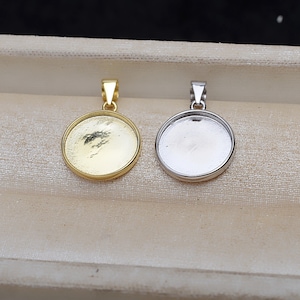 May include: Two round pendant trays, one gold and one silver, with a bail loop at the top. The trays are blank and ready for resin or other embellishments.