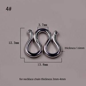 May include: Silver clasp for a necklace, measuring 13.8 mm wide, 12.3 mm high, and 1.6 mm thick. The clasp is marked with "S999" and is designed for necklace chains with a thickness of 3 mm to 4 mm.
