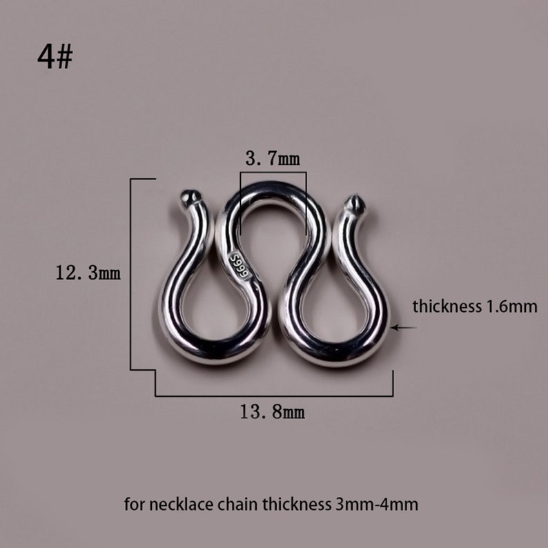 May include: Silver clasp for a necklace, measuring 13.8 mm wide, 12.3 mm high, and 1.6 mm thick. The clasp is marked with "S999" and is designed for necklace chains with a thickness of 3 mm to 4 mm.