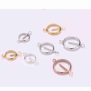 May include: Six round metal connector charms with a small opening in the center. The charms are available in gold, silver, and rose gold.