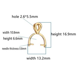 May include: A gold-colored pendant bail with dimensions labeled. The bail has a loop at the top and a curved base with two prongs. The height is 16.9mm, width is 13.2mm, and the needle thickness is 0.8mm.