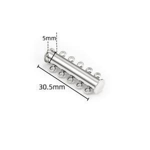 May include: A silver-toned metal multi-strand jewelry clasp featuring a cylindrical tube design with five small loops on one side for attaching chains. The clasp measures 30.5mm in length and 5mm in width as indicated by the technical diagram.