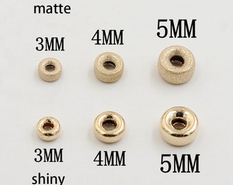 May include: Six gold-colored metal beads in three sizes: 3mm, 4mm, and 5mm. The beads are shown in two finishes: matte and shiny.