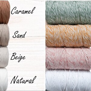 May include: Four rows of cotton cord in various colours, including caramel, sand, beige, natural, mojito, sunflower, strawberry, and white. The cords are arranged in a vertical stack, with the colours alternating between the left and right sides of the image.