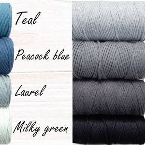May include: Four spools of cotton cord in various shades of blue and grey. The colours are teal, peacock blue, laurel, milky green, light grey, grey, charcoal, and black.