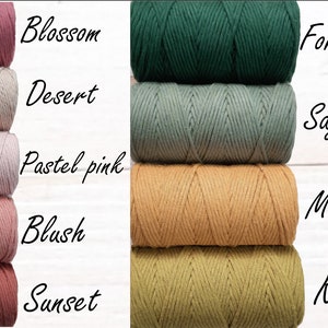May include: Five spools of cotton cord in various colours, including blush, sunset, desert, pastel pink, and blossom.  On the right side of the image, five spools of cotton cord in various colours, including forest green, sage green, mustard, and kiwi.