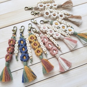 Daisy macrame keychains with wooden bead names.