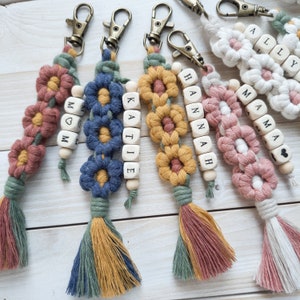 Daisy macrame keychains with wooden bead names.