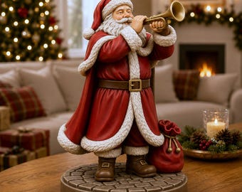 May include: A Santa Claus figurine standing on a cobblestone base, wearing a red coat with white fur trim and a matching hat. Santa has a long white beard and is holding a gold trumpet to his mouth. A red sack sits at his feet on the base.