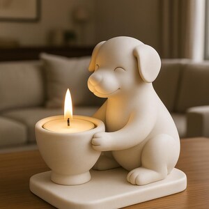 May include: A white ceramic dog-shaped candle holder. The dog is smiling and holding a small bowl with a lit candle. The candle holder sits on a square base. The overall design is simple and elegant, suitable for home decor.