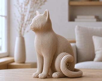 May include: A beige cat figurine constructed from a series of vertical, parallel, layered lines that form the shape of a seated feline. The sculpture features a smooth, uniform texture and a continuous, ribbed design that defines the cat's body.