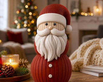 May include: A decorative Santa Claus figurine featuring a ribbed red body and hat with a white brim and pom-pom. The figure has a tan face with black bead eyes, a small nose, and a textured white mustache and long beard, with two white buttons.